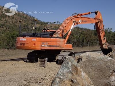 Cutting through rock with the aid of GPS guidance.