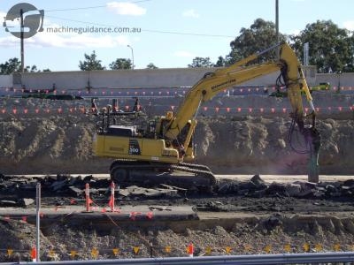 Using machine guidance with a rockhammer.