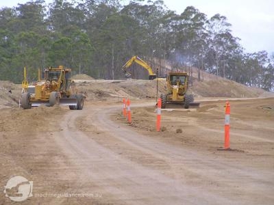 Trimble ATS and Topcon Millimeter trim graders in action.