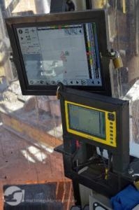 Machine guidance displays mounted inside drill rig.