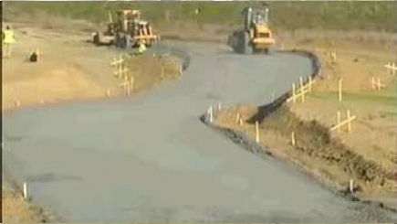 GPS Excavator Cutting Through Rock